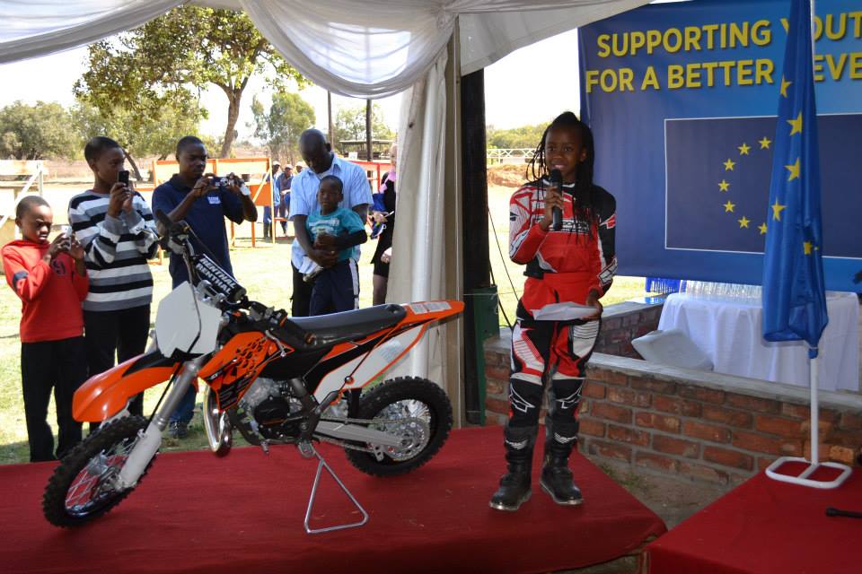 Hand over Ceremony of a KTM 65cc to Tanya by the EU Delegation of Zimbabwe